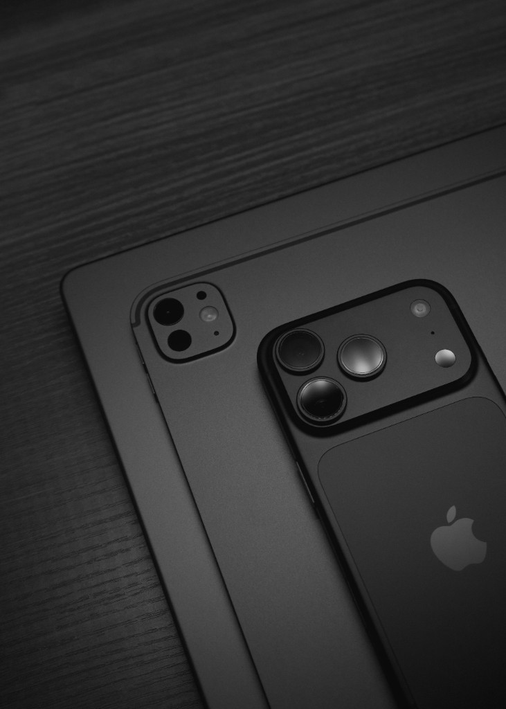 Black iPhone Pro resting on an iPad Pro